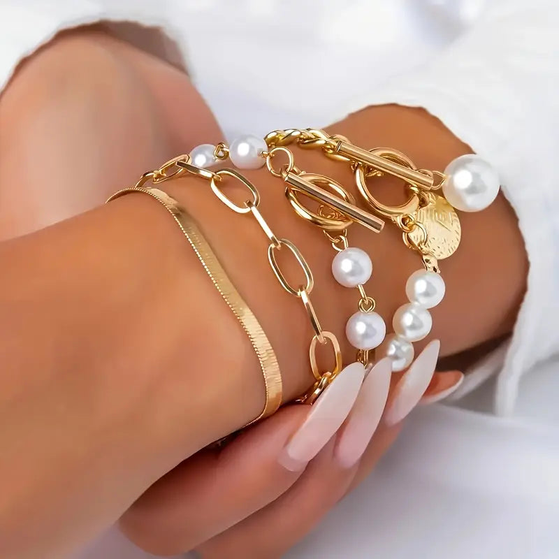 Conjunto elegante de 4 pulseras doradas: serpiente, perlas y eslabones | Oro