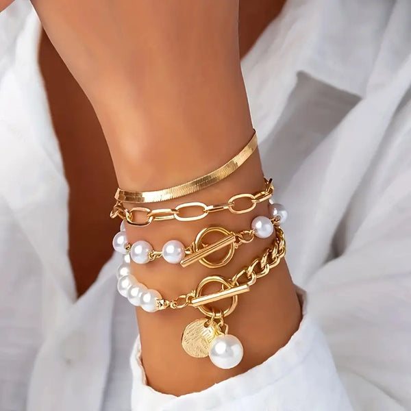 Conjunto elegante de 4 pulseras doradas: serpiente, perlas y eslabones | Oro