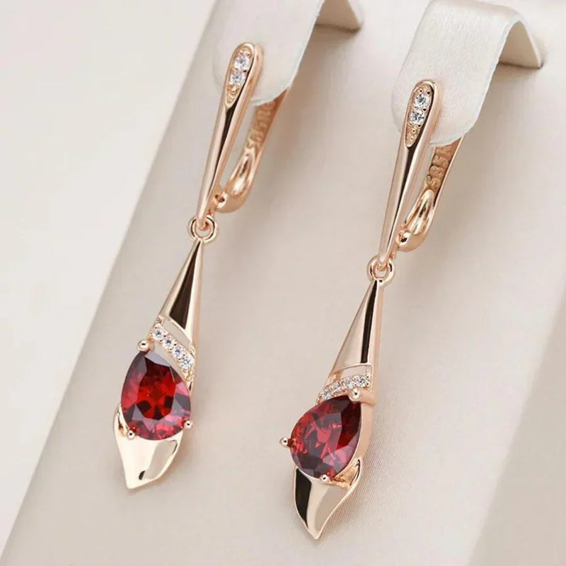 Exquisito colgante con pendientes de cristal rojo | Oro
