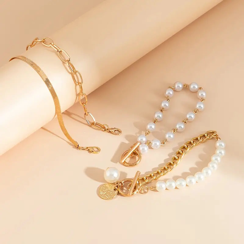 Conjunto elegante de 4 pulseras doradas: serpiente, perlas y eslabones | Oro